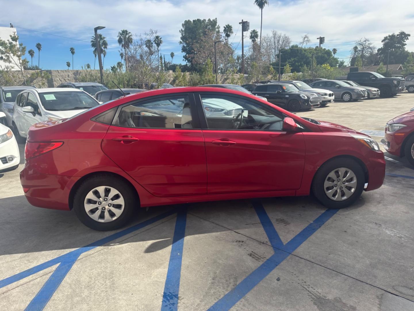 2015 Red /Gray Hyundai Accent GLS Sedan 4D (KMHCT4AE2FU) with an 4-Cyl, 1.6L engine, Auto, 6-Spd w/Overdrive transmission, located at 30 S. Berkeley Avenue, Pasadena, CA, 91107, (626) 248-7567, 34.145447, -118.109398 - The 2015 Hyundai Accent 4-Door Sedan stands as a testament to Hyundai's commitment to quality, efficiency, and value. Located in Pasadena, CA, our dealership specializes in providing a wide range of used BHPH (Buy Here Pay Here) cars, trucks, SUVs, and vans, including the remarkable Hyundai Accent. - Photo#6